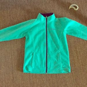 a turquoise Columbia jacket